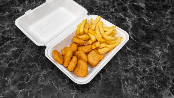 Chicken and chips in a foam clamshell